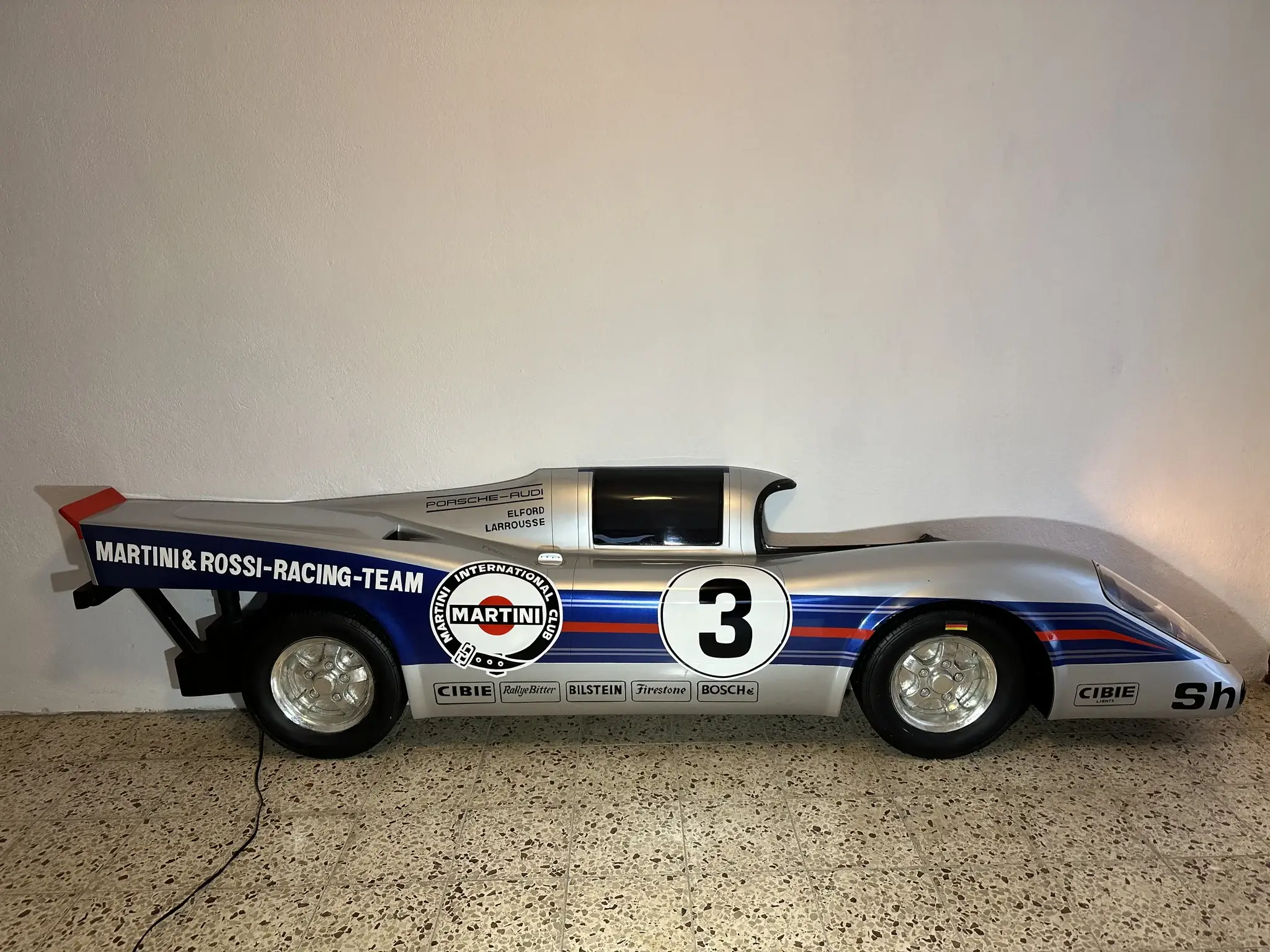 MP: Illuminated Half of a Porsche 917 Martini Racing Wall Decor