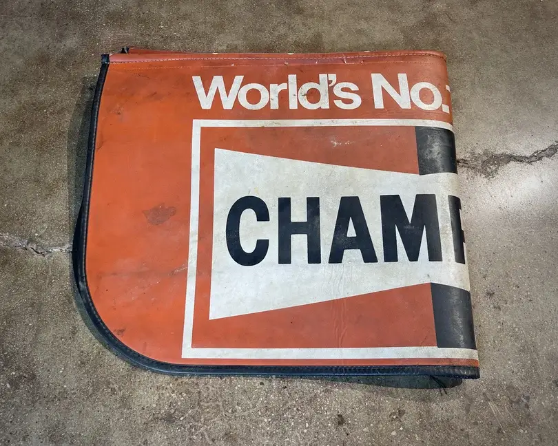 No Reserve Vintage Champion Spark Plugs Fender Cover | PCARMARKET